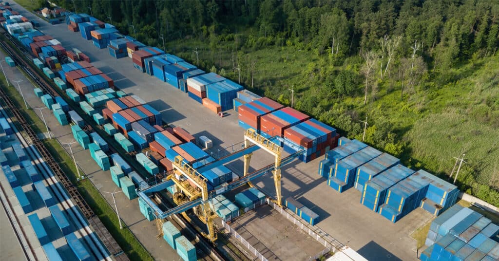 Aerial view of multicolored intermodal containers at the railway customs.