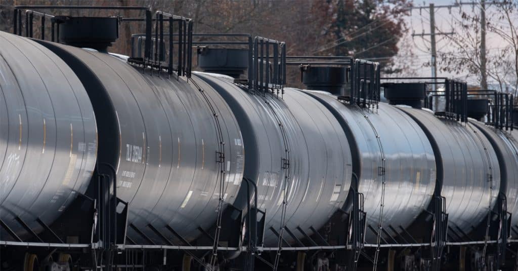 A line of black rail tank cars.