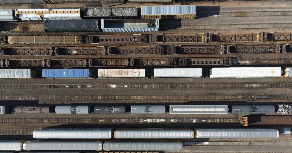 An overhead view of a variety of railcars in a railcar storage yard.