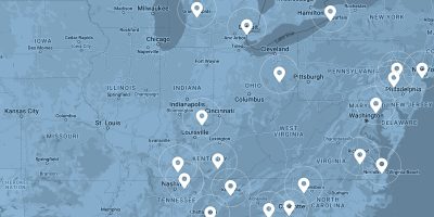 A map of North America overlaid in blue with white location markers.
